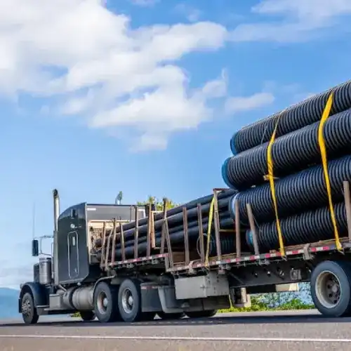 Step deck trailer parked for routine inspection as part of regular step deck maintenance